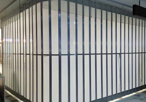 See-through polycarbonate sliding door for showroom entrance